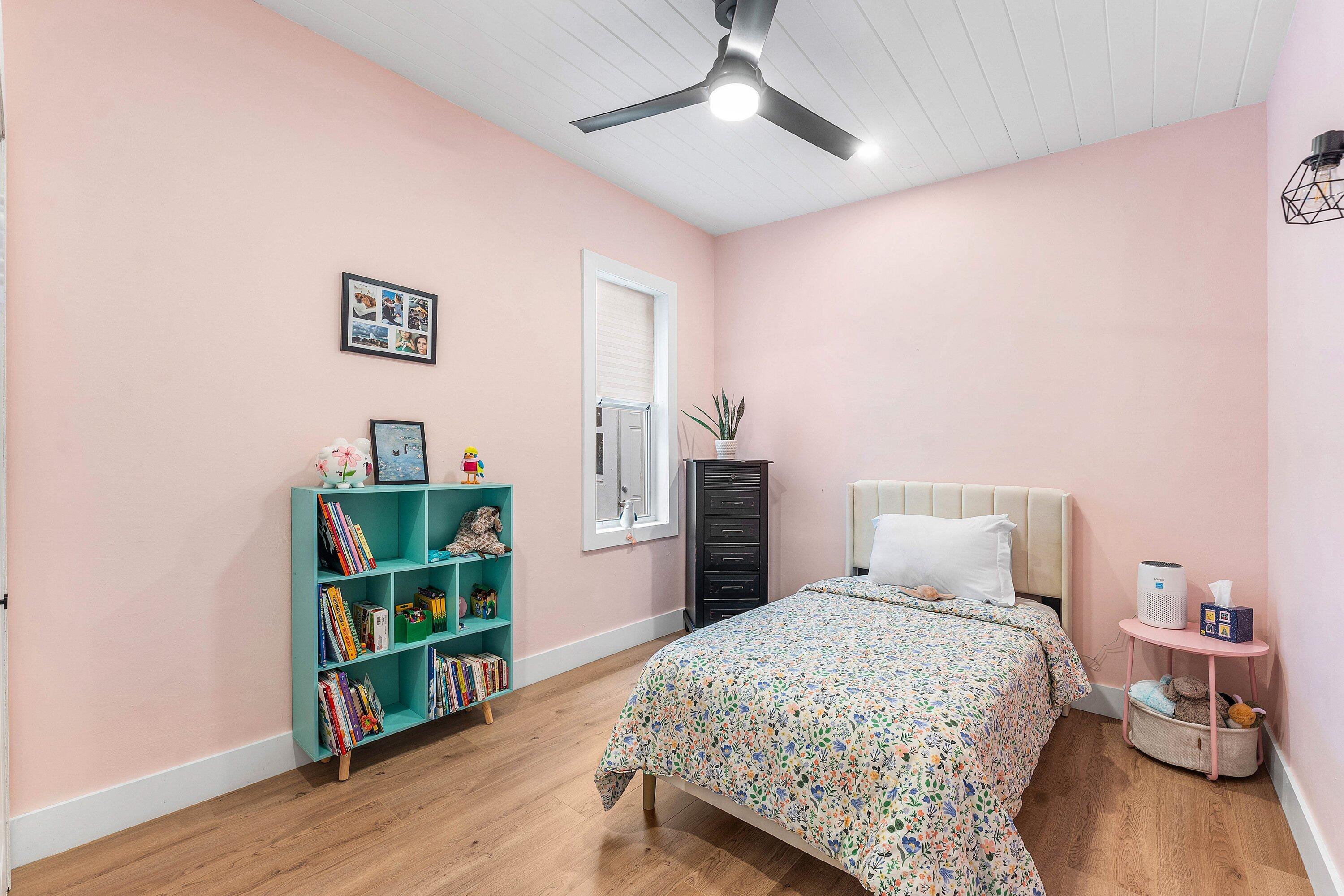 709 Southwest 9th Court Delray Beach, FL 33444 - Photo 20 of 32 a bedroom with bed and a wooden floor