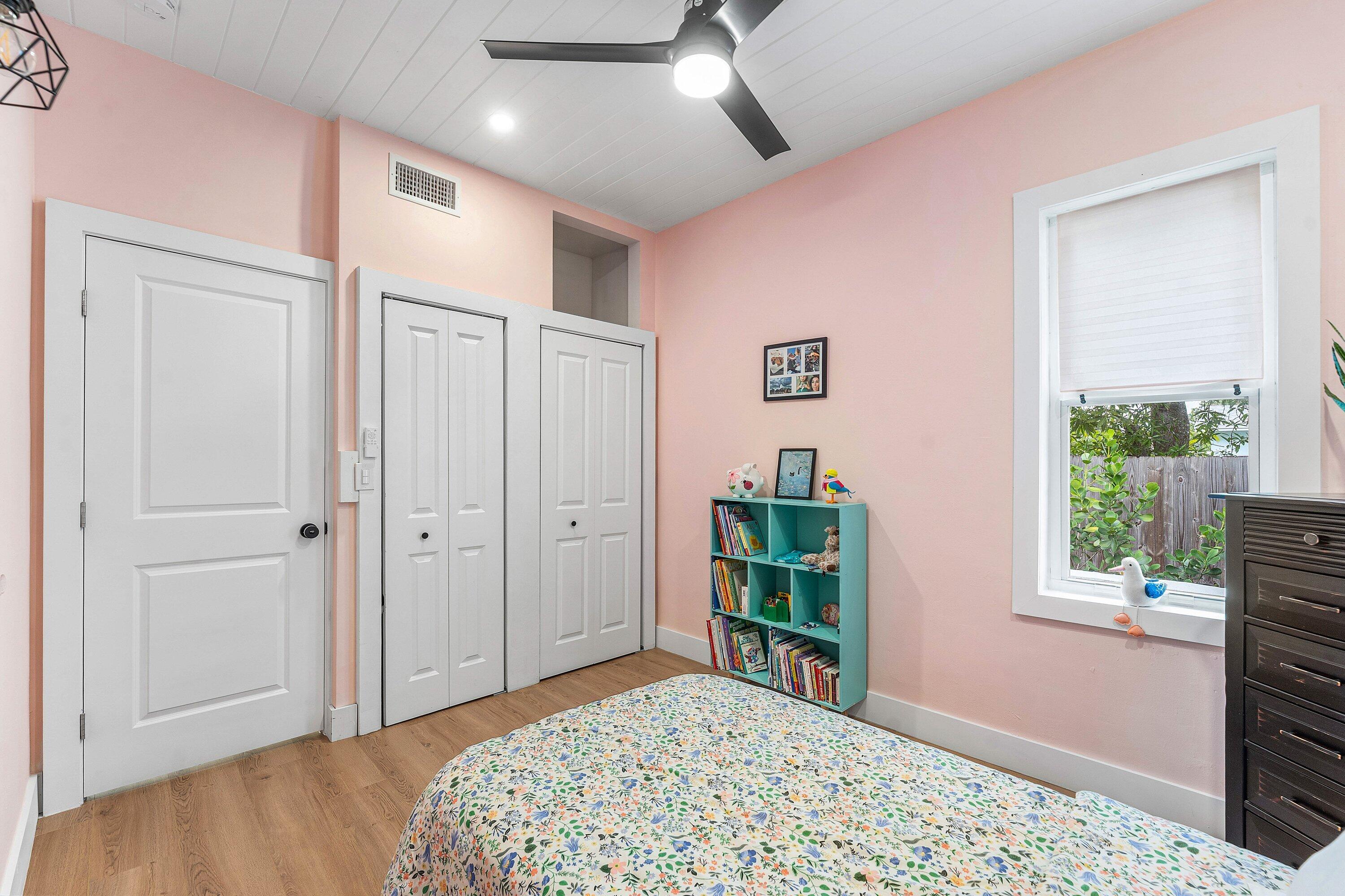 709 Southwest 9th Court Delray Beach, FL 33444 - Photo 21 of 32 a bedroom with a bed and a window