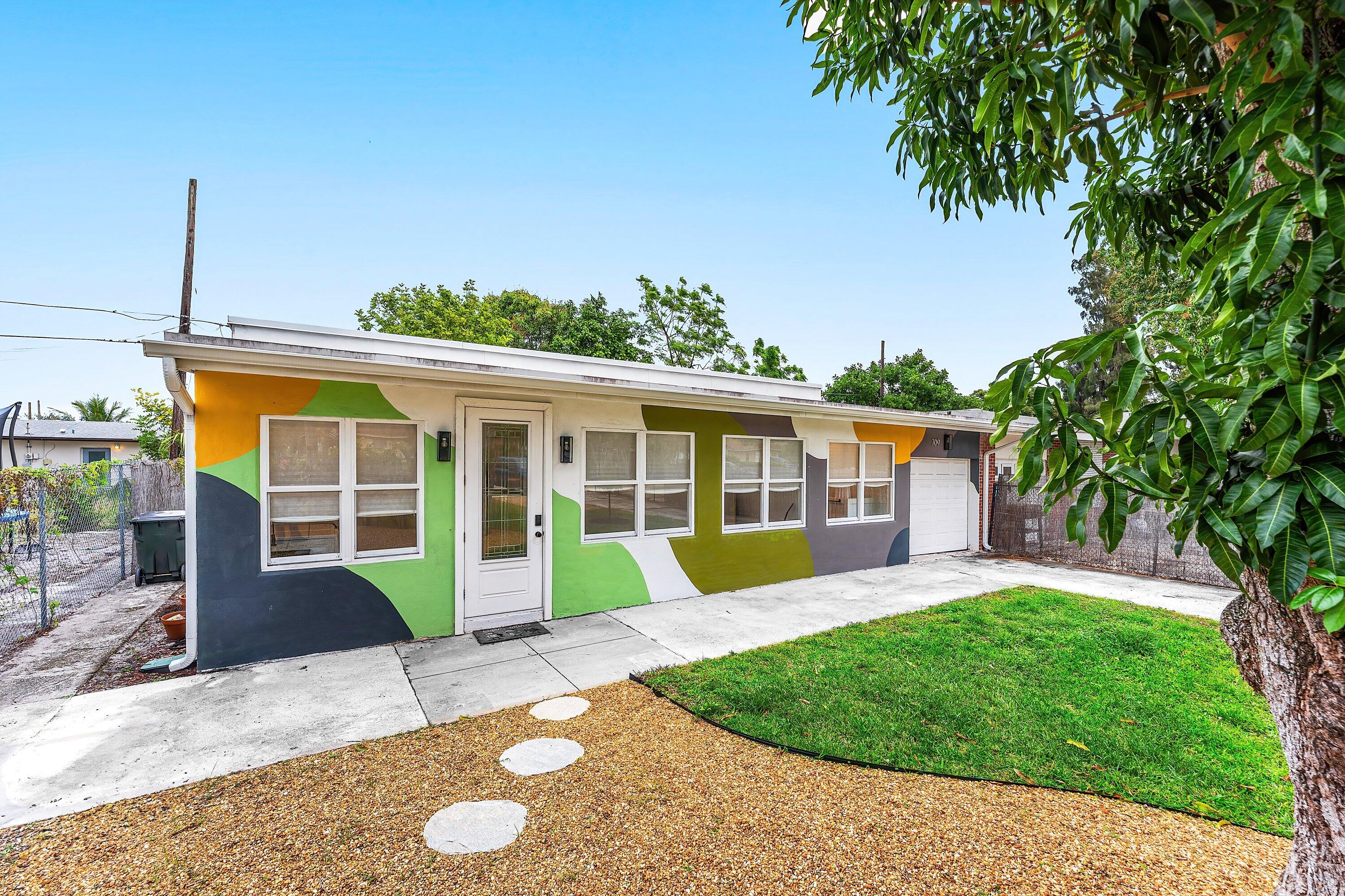 709 Southwest 9th Court Delray Beach, FL 33444 - Photo 3 of 32 a view of a house with a backyard