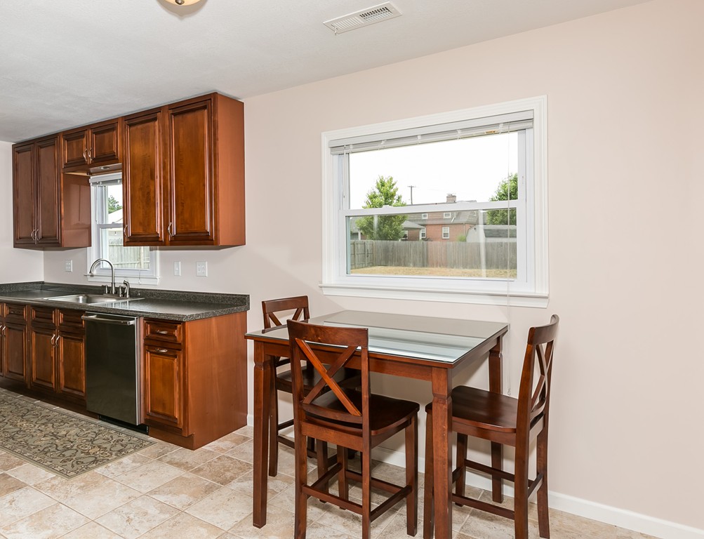 32 Old Farm Road Springfield, MA 01119 - Photo 13 of 27 a dining room with a window a sink and a microwave