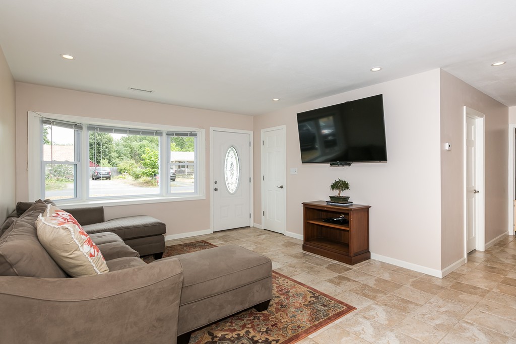 32 Old Farm Road Springfield, MA 01119 - Photo 8 of 27 a living room with furniture and a flat screen tv