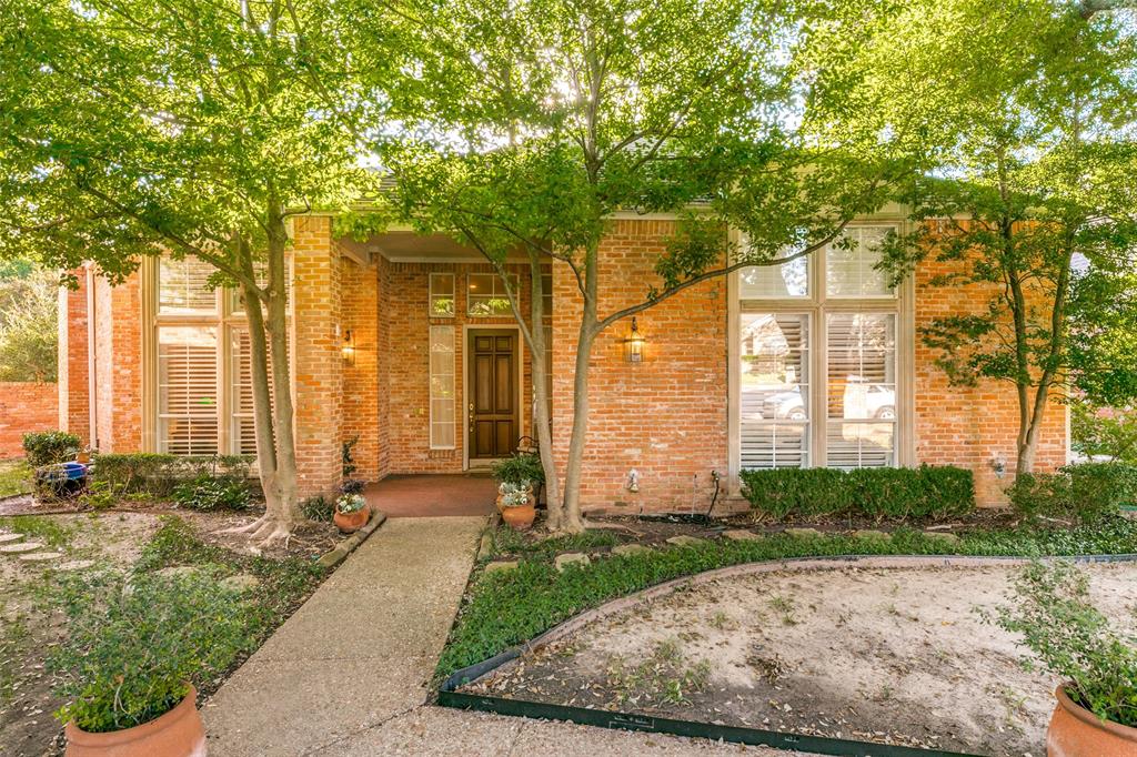 a view of backyard with patio