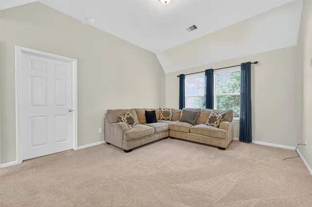 a living room with furniture and a window