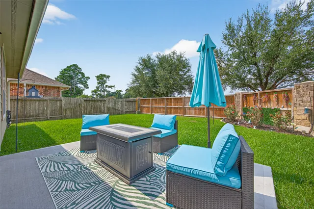 a view of outdoor sitting area with furniture