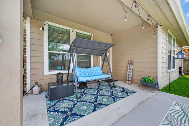 a view of a patio with couches chairs and a fire pit