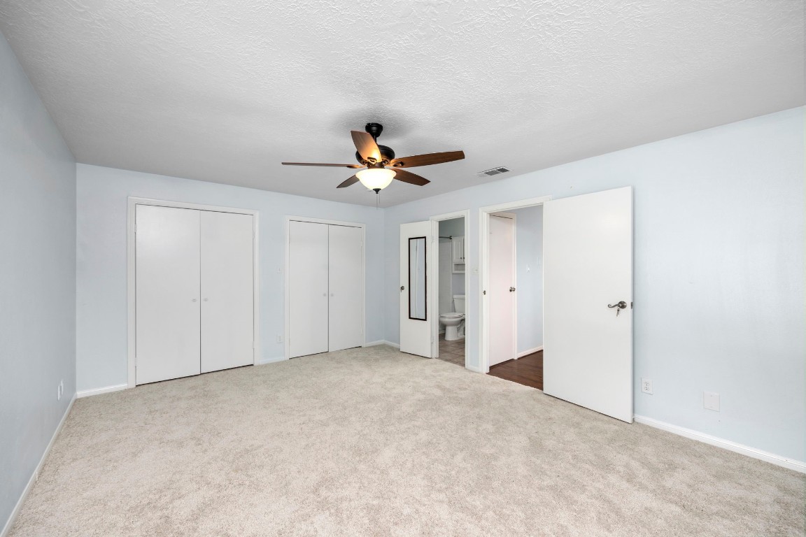 12755 Mill Ridge Drive, Unit 301 Cypress, TX 77429 - Photo 14 of 24 a view of a livingroom with a ceiling fan