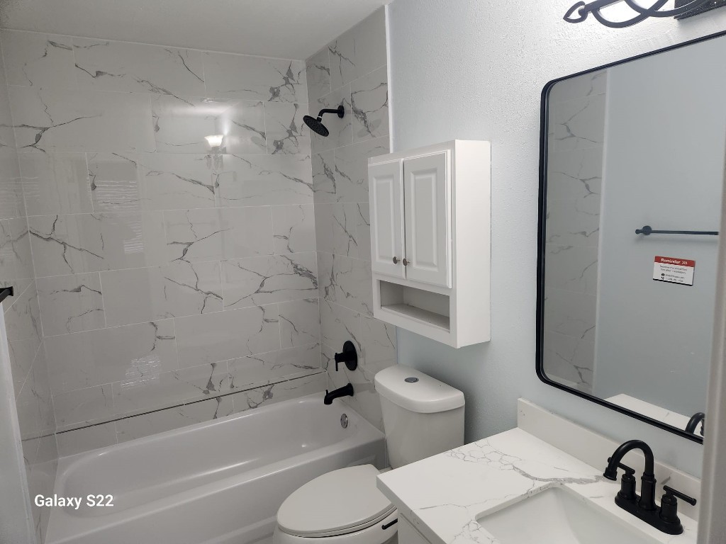 12755 Mill Ridge Drive, Unit 301 Cypress, TX 77429 - Photo 17 of 24 a bathroom with a sink toilet and shower