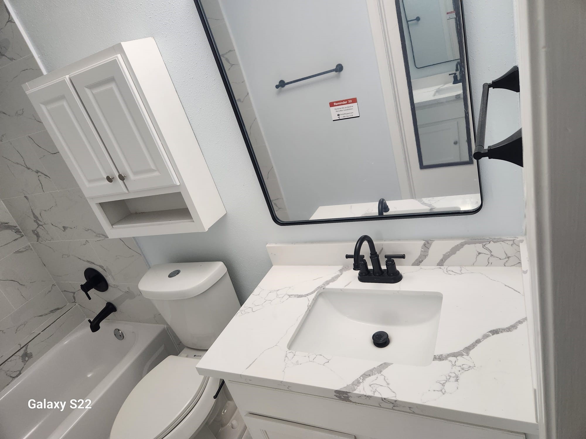 12755 Mill Ridge Drive, Unit 301 Cypress, TX 77429 - Photo 18 of 24 a bathroom with a sink and a mirror