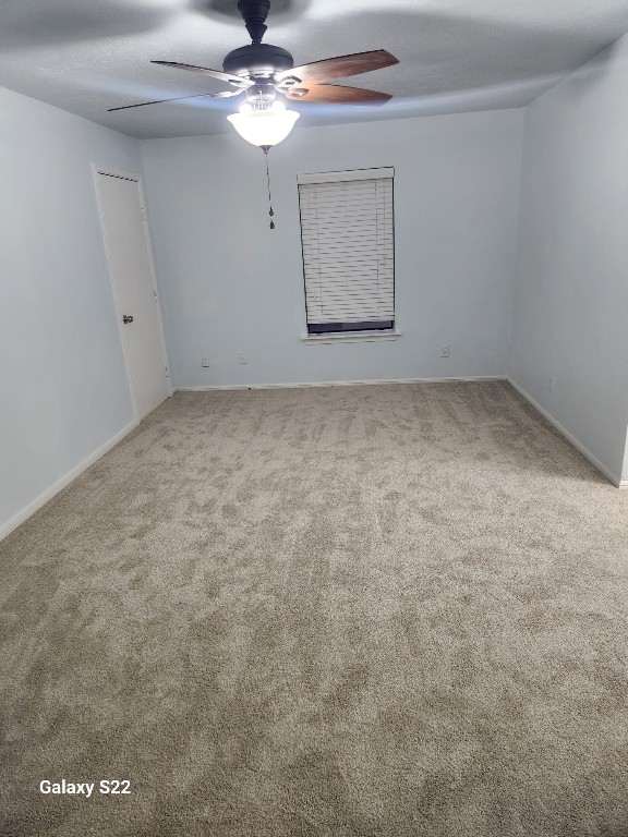 12755 Mill Ridge Drive, Unit 301 Cypress, TX 77429 - Photo 20 of 24 an empty room with a chandelier fan