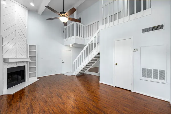 a view of a room with window and stairs