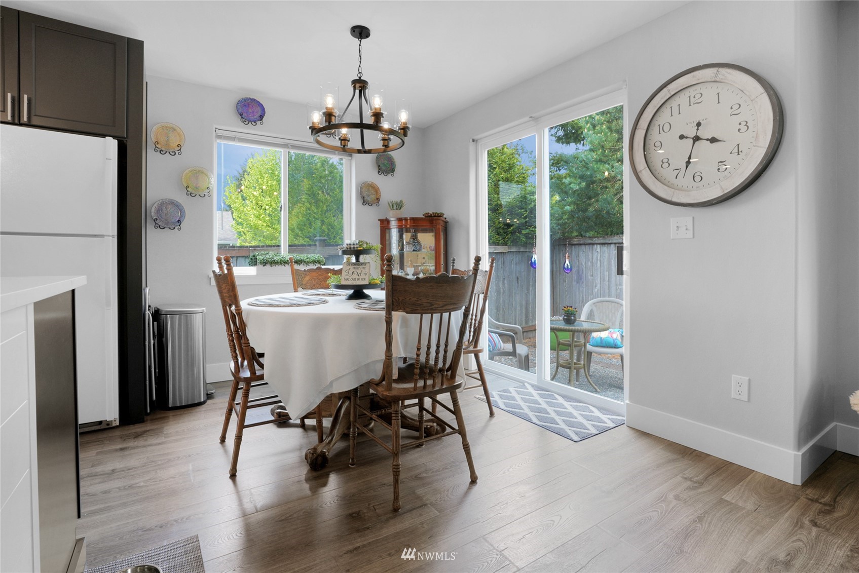 19303 Crown Ridge Boulevard Arlington, WA 98223 - Photo 13 of 30 a view of a dining room with furniture window and wooden floor