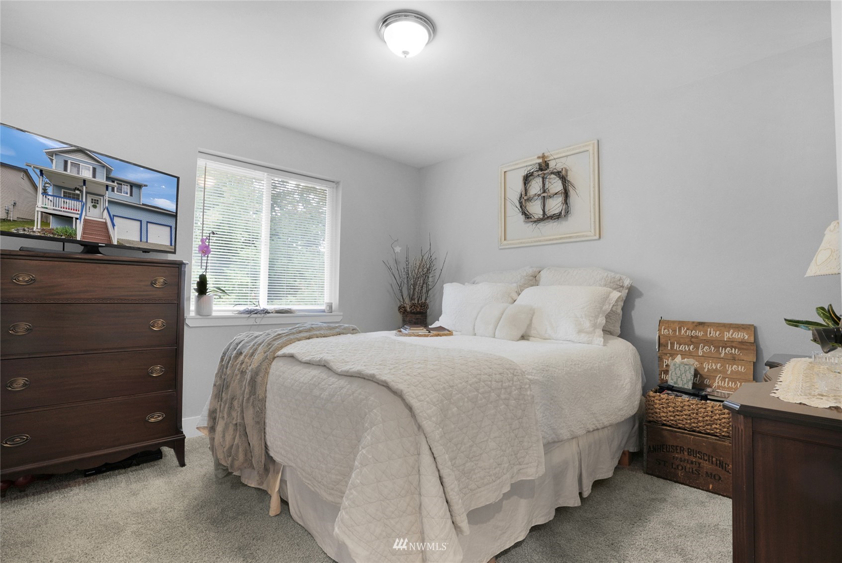19303 Crown Ridge Boulevard Arlington, WA 98223 - Photo 16 of 30 a bedroom with a bed and a window