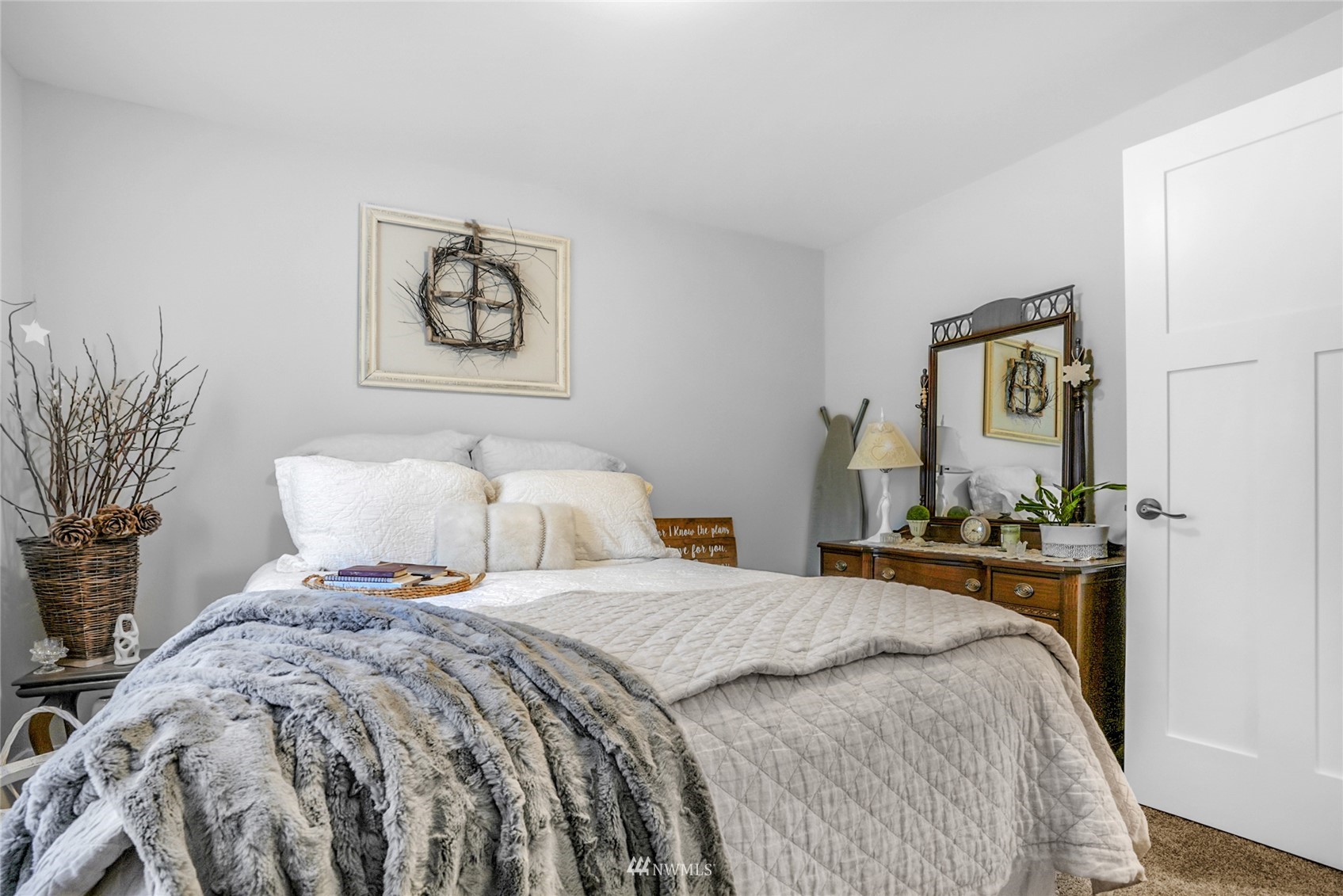 19303 Crown Ridge Boulevard Arlington, WA 98223 - Photo 17 of 30 a bedroom with bed and paintings on the wall