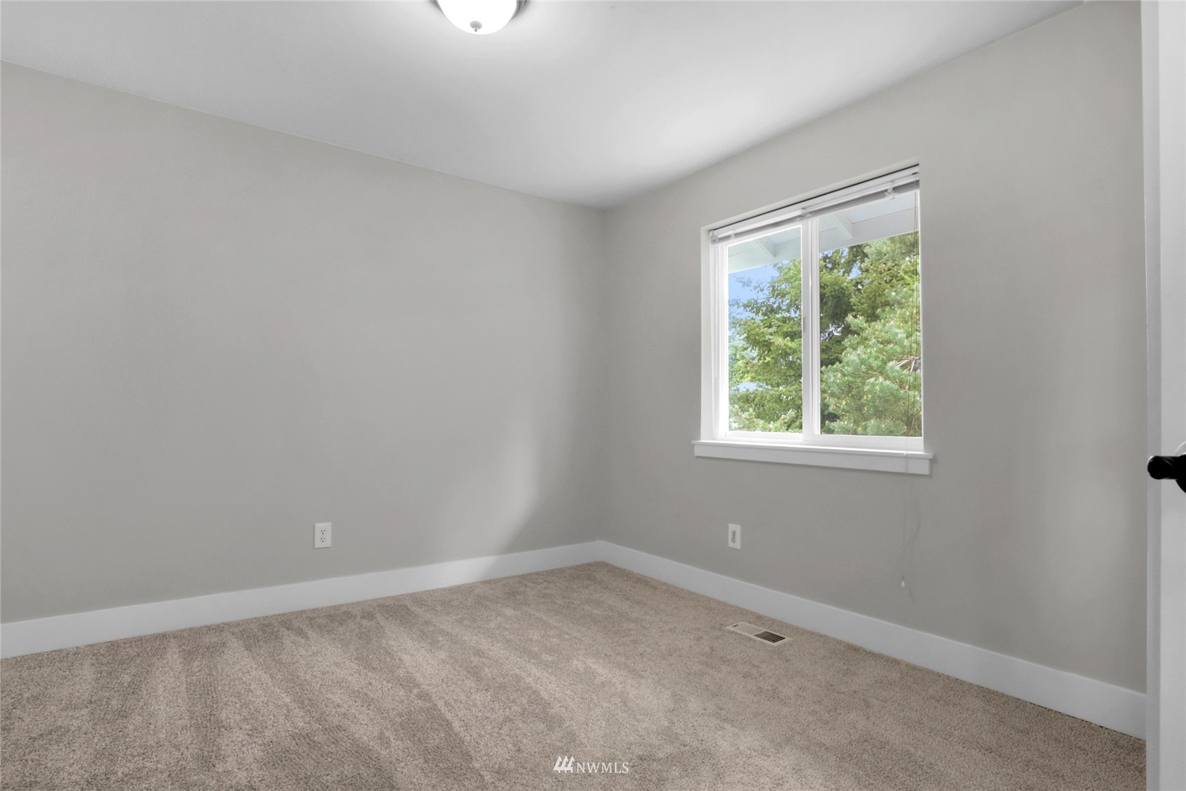 19303 Crown Ridge Boulevard Arlington, WA 98223 - Photo 19 of 30 an empty room with a window
