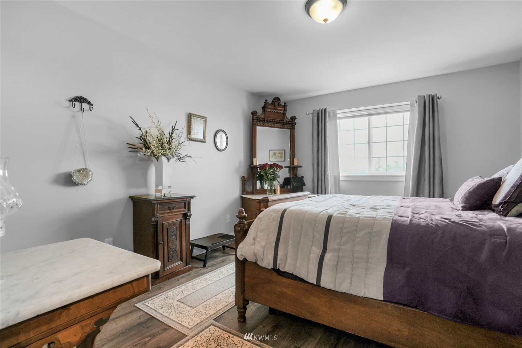 19303 Crown Ridge Boulevard Arlington, WA 98223 - Photo 22 of 30 a bedroom with a bed and a table