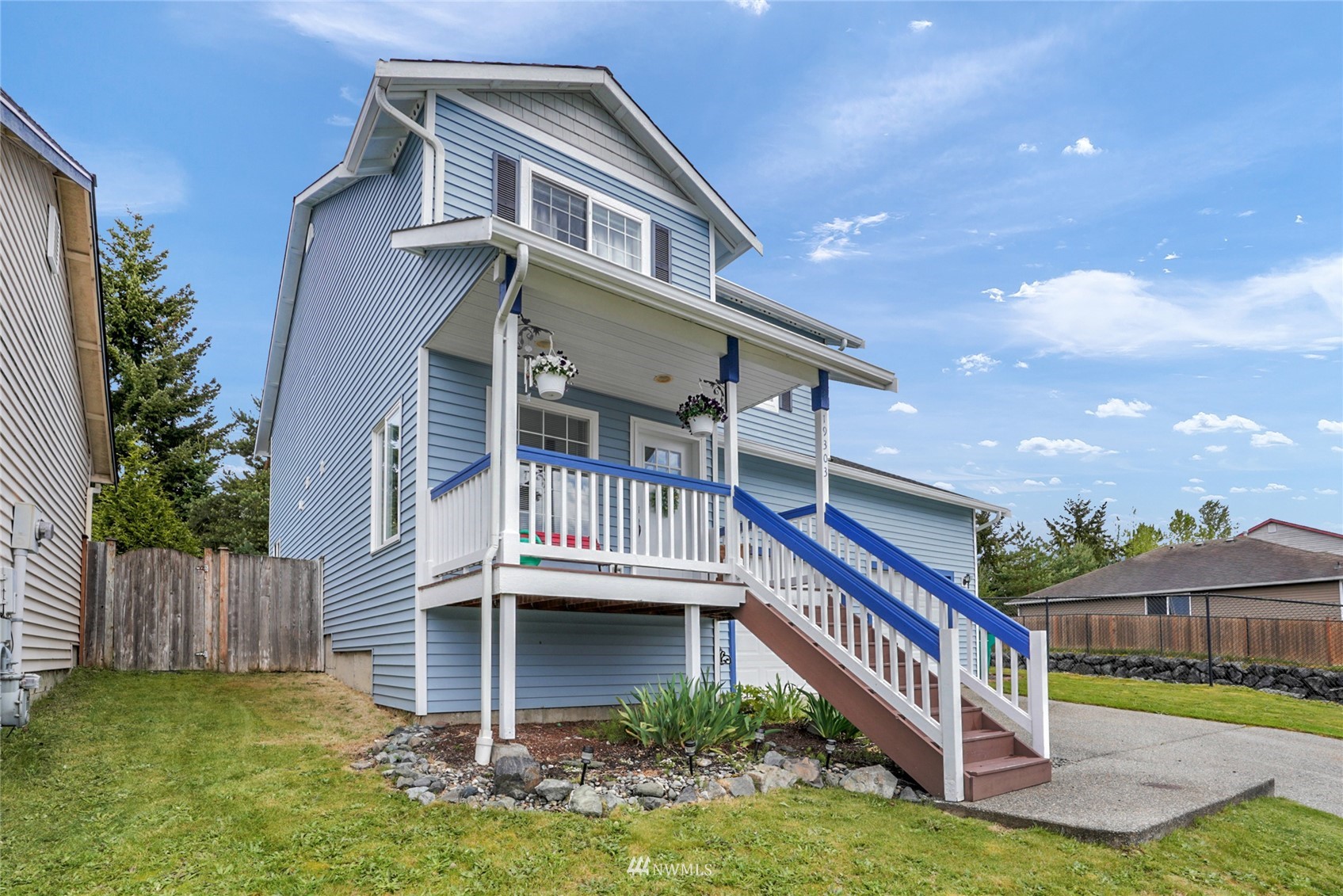 19303 Crown Ridge Boulevard Arlington, WA 98223 - Photo 3 of 30 a balcony with a yard and plants