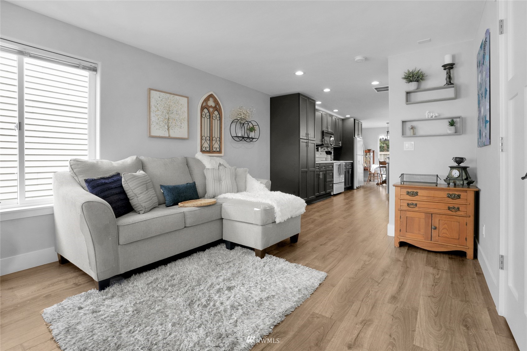 19303 Crown Ridge Boulevard Arlington, WA 98223 - Photo 6 of 30 a living room with furniture and a wooden floor