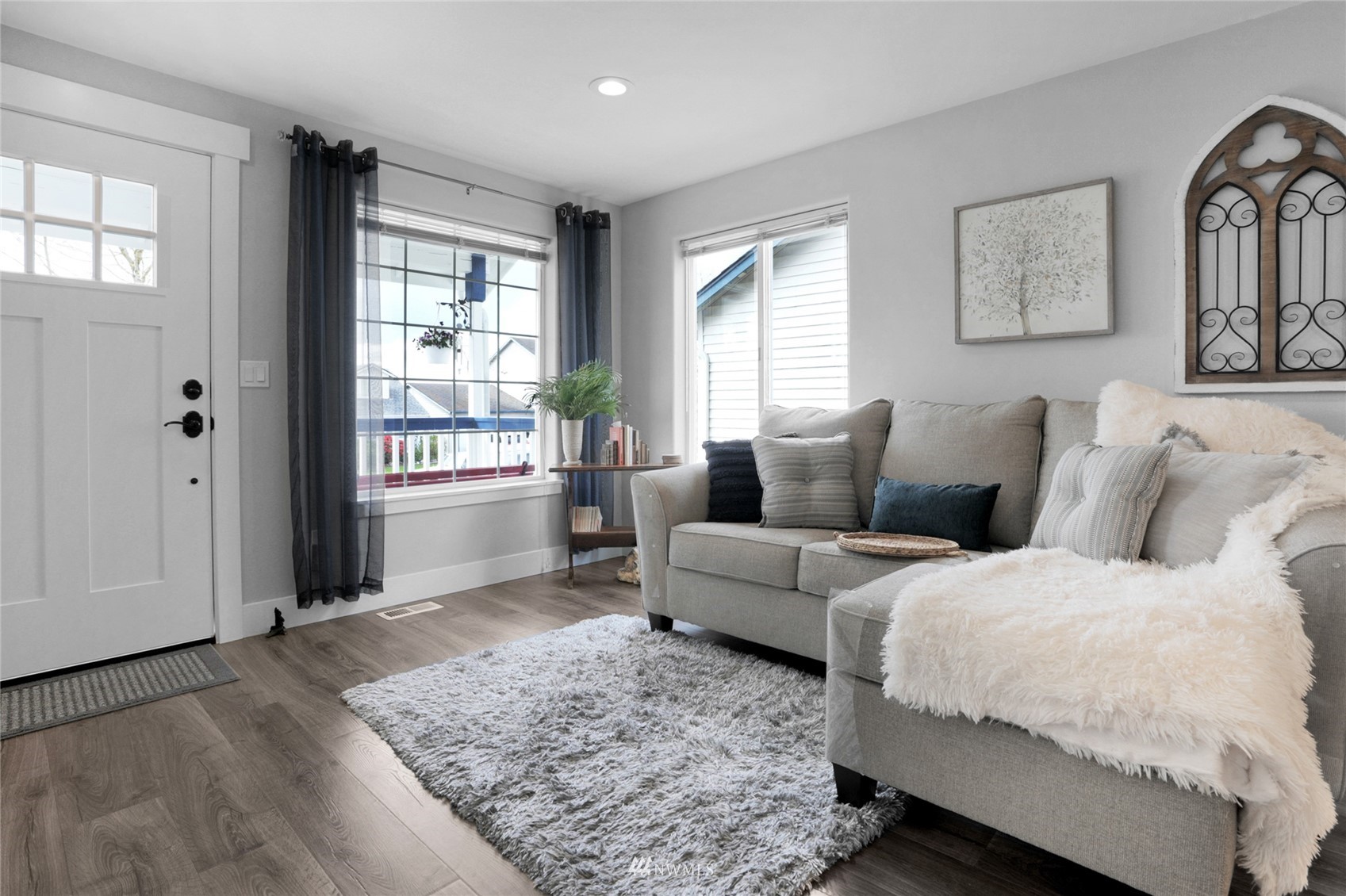 19303 Crown Ridge Boulevard Arlington, WA 98223 - Photo 7 of 30 a living room with a couch and a window