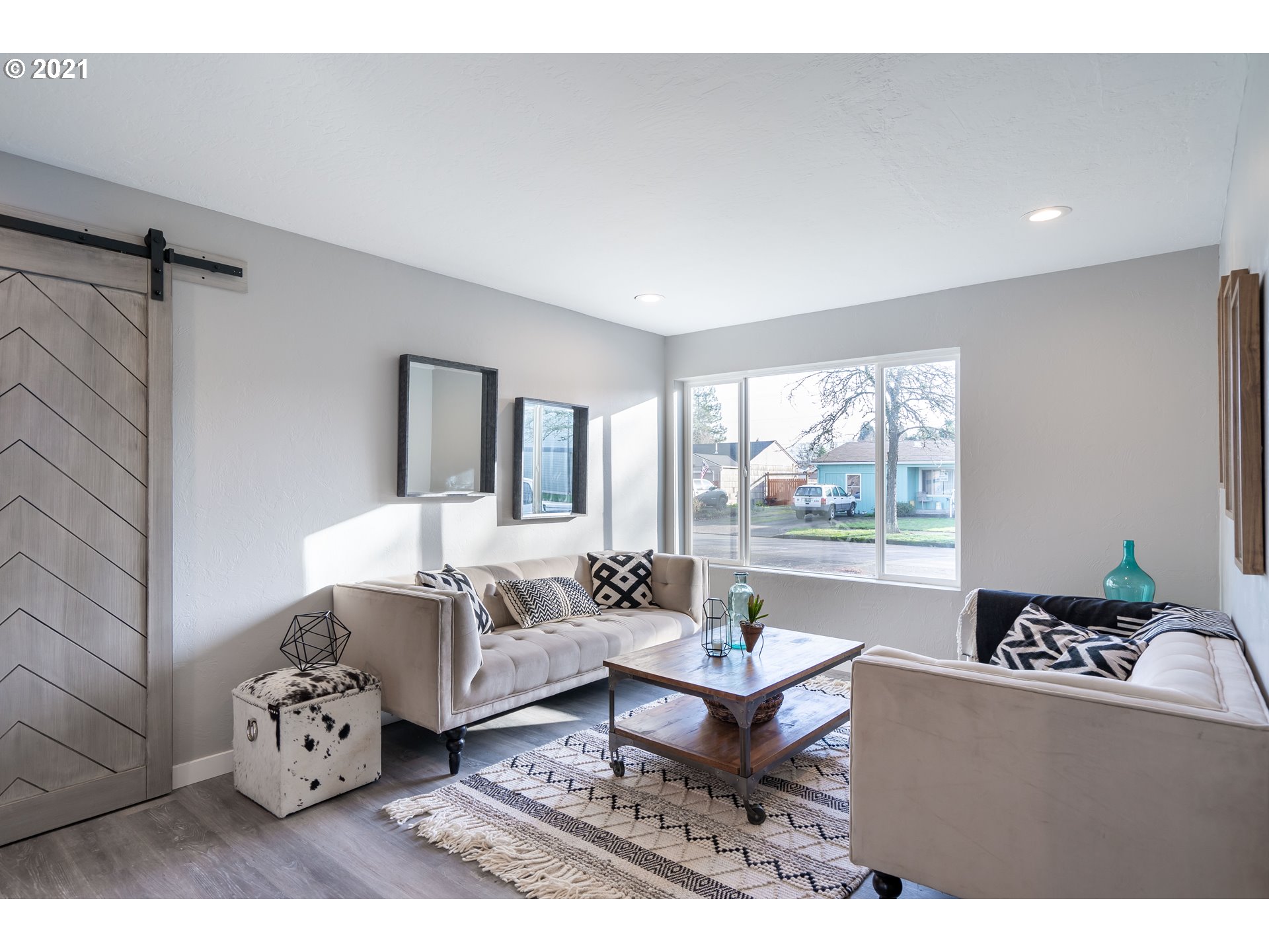 1214 L Street Springfield, OR 97477 - Photo 13 of 24 a living room with furniture and a large window