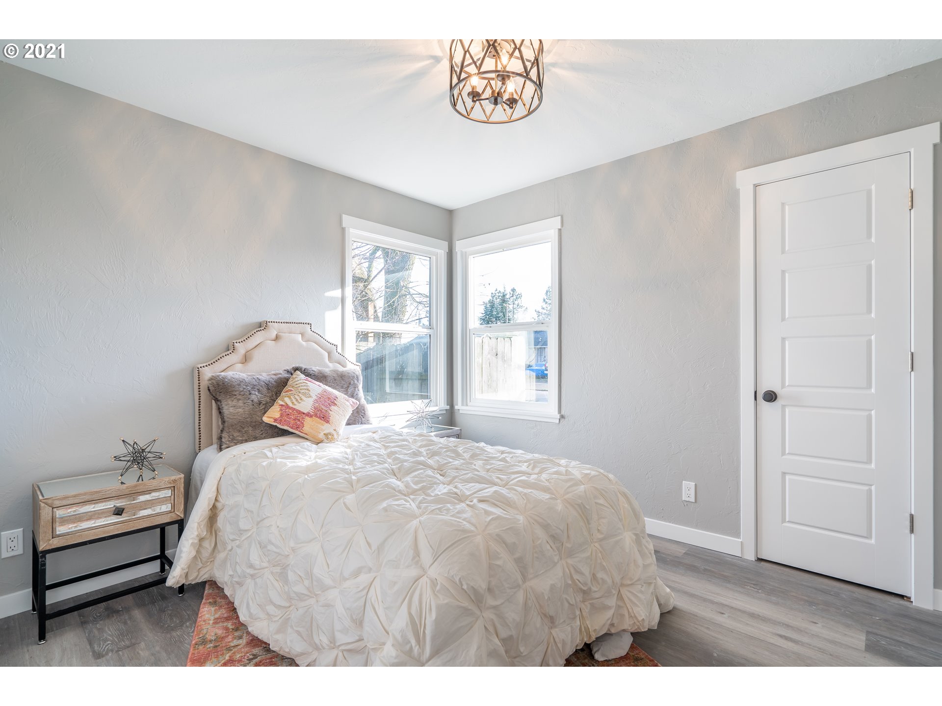 1214 L Street Springfield, OR 97477 - Photo 18 of 24 a bedroom with a bed and a window