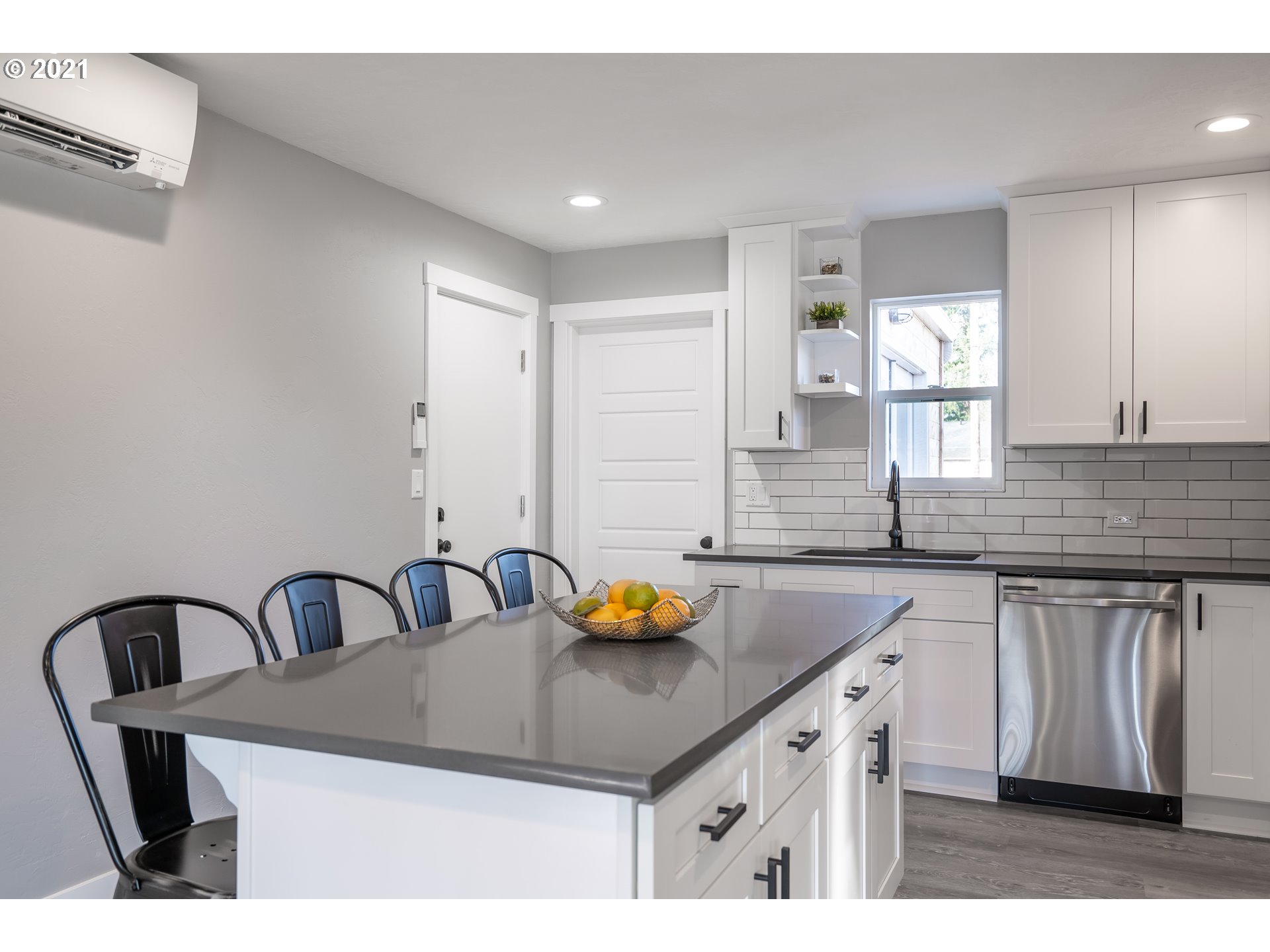 1214 L Street Springfield, OR 97477 - Photo 5 of 24 a kitchen with a sink a counter space and cabinets