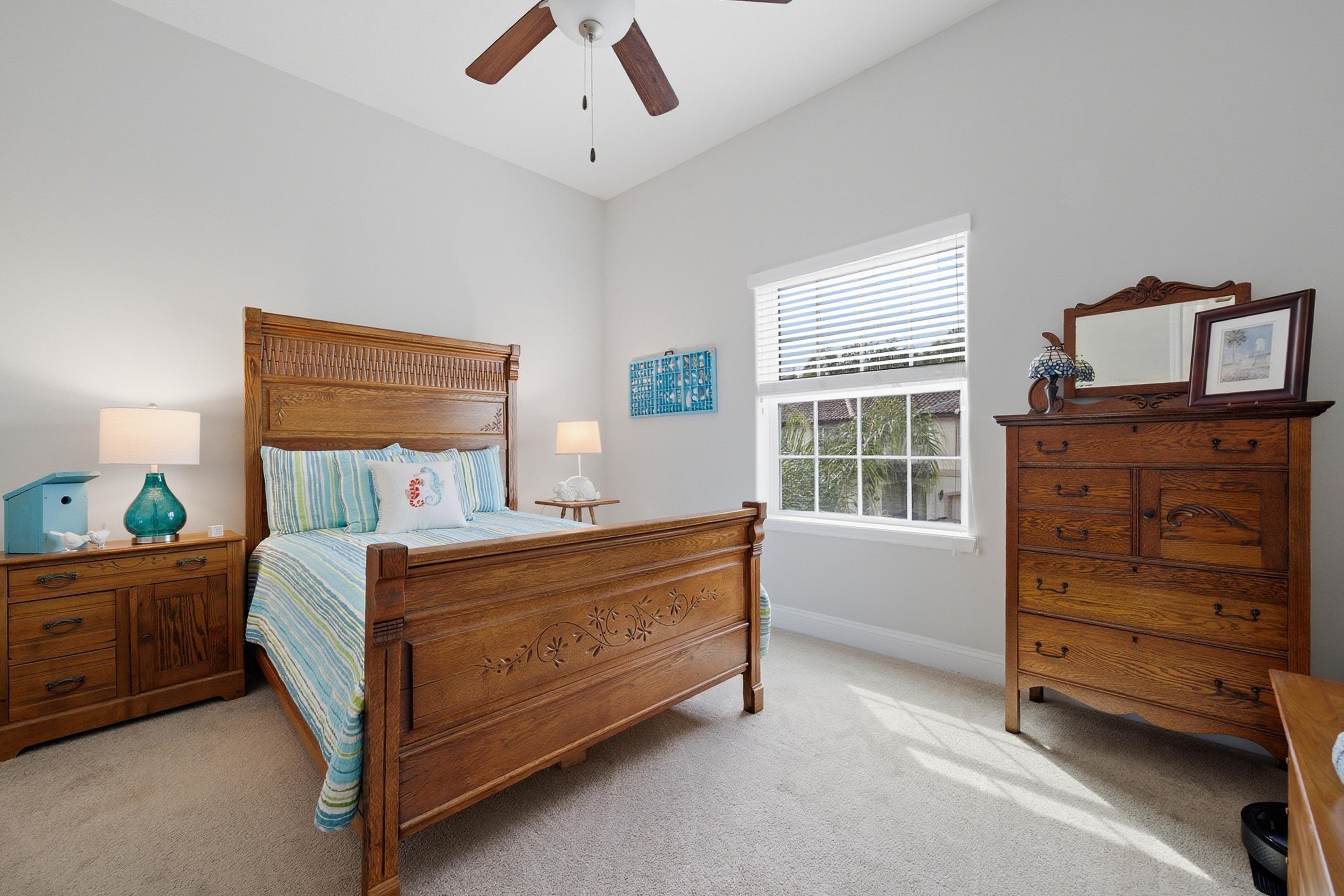 200 Grand Ravine Drive St. Augustine, FL 32086 - Photo 19 of 34 Bedroom featuring light carpet and ceiling fan