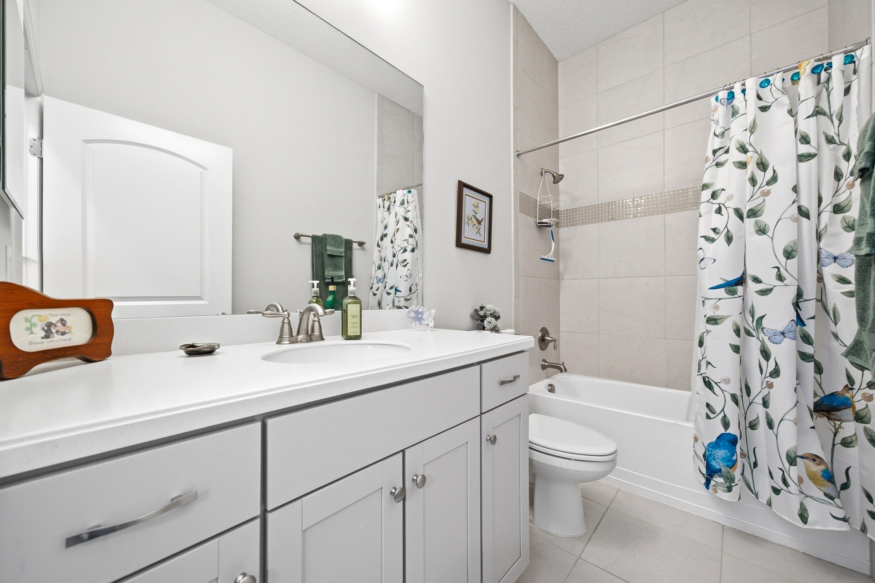 200 Grand Ravine Drive St. Augustine, FL 32086 - Photo 23 of 34 Full bath with shower / bathtub combination with curtain, vanity, and light tile patterned floors