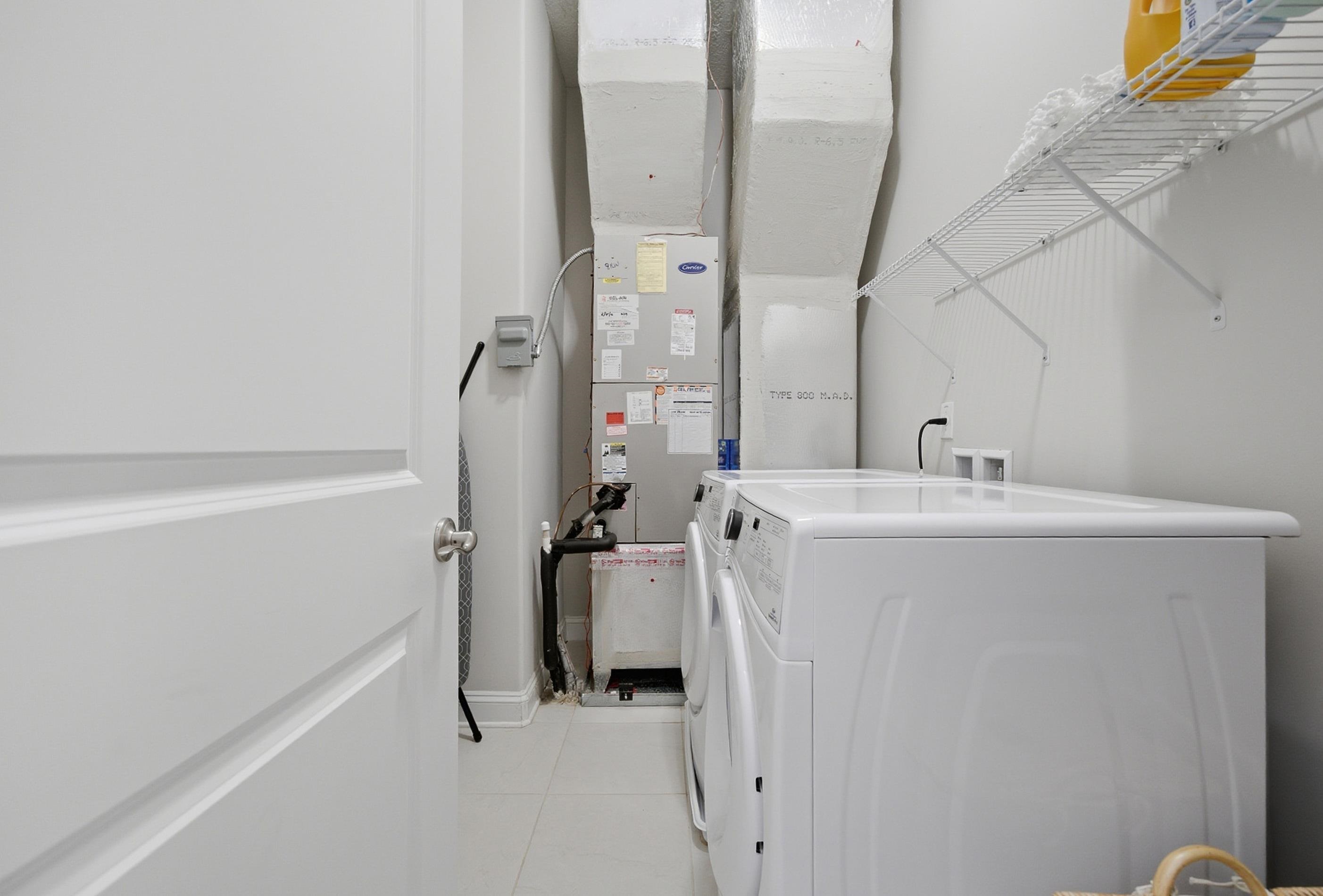 200 Grand Ravine Drive St. Augustine, FL 32086 - Photo 25 of 34 Laundry room featuring washer and dryer and light tile patterned floors