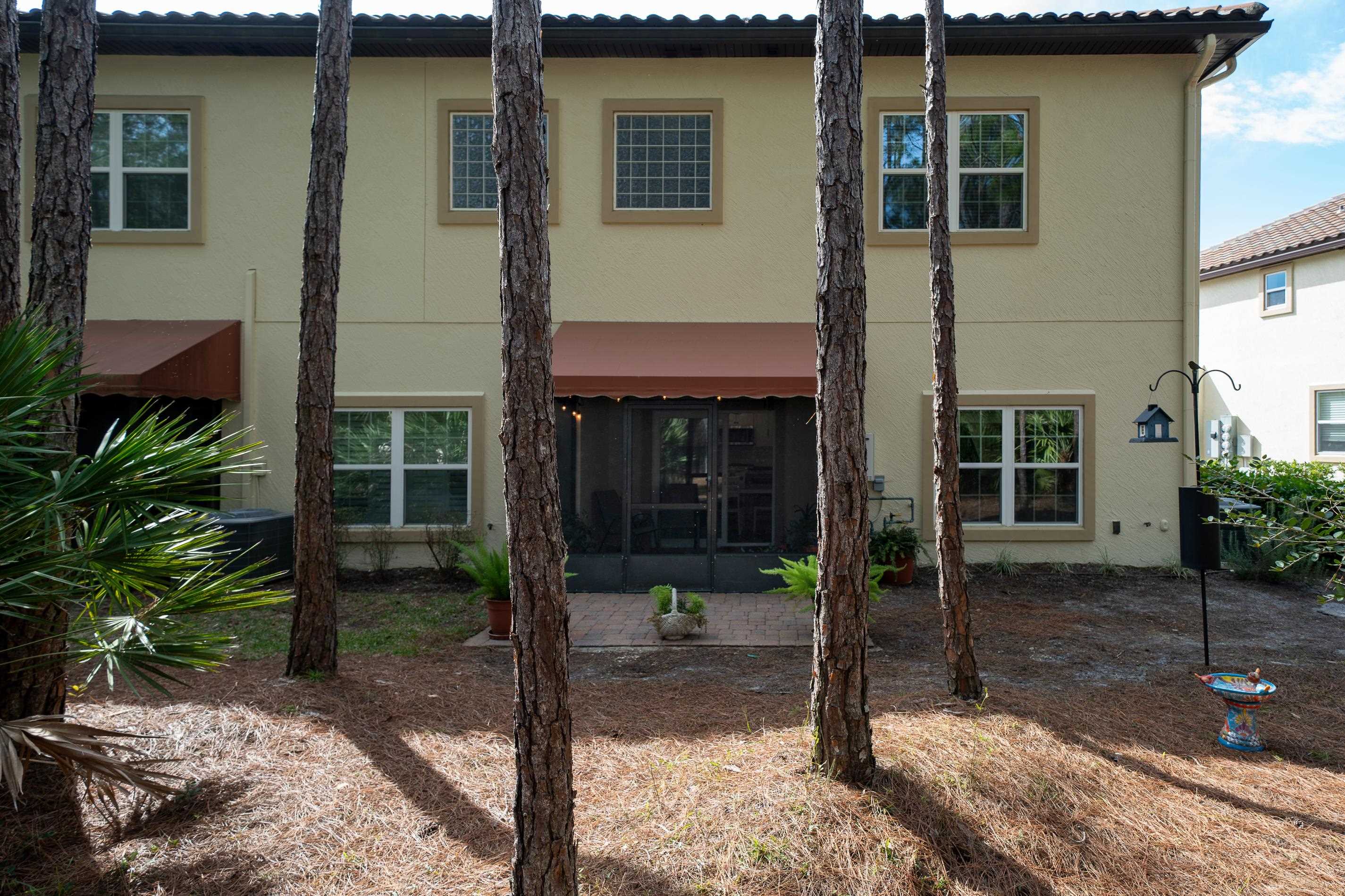 200 Grand Ravine Drive St. Augustine, FL 32086 - Photo 34 of 34 Rear view of property featuring stucco siding and a sunroom