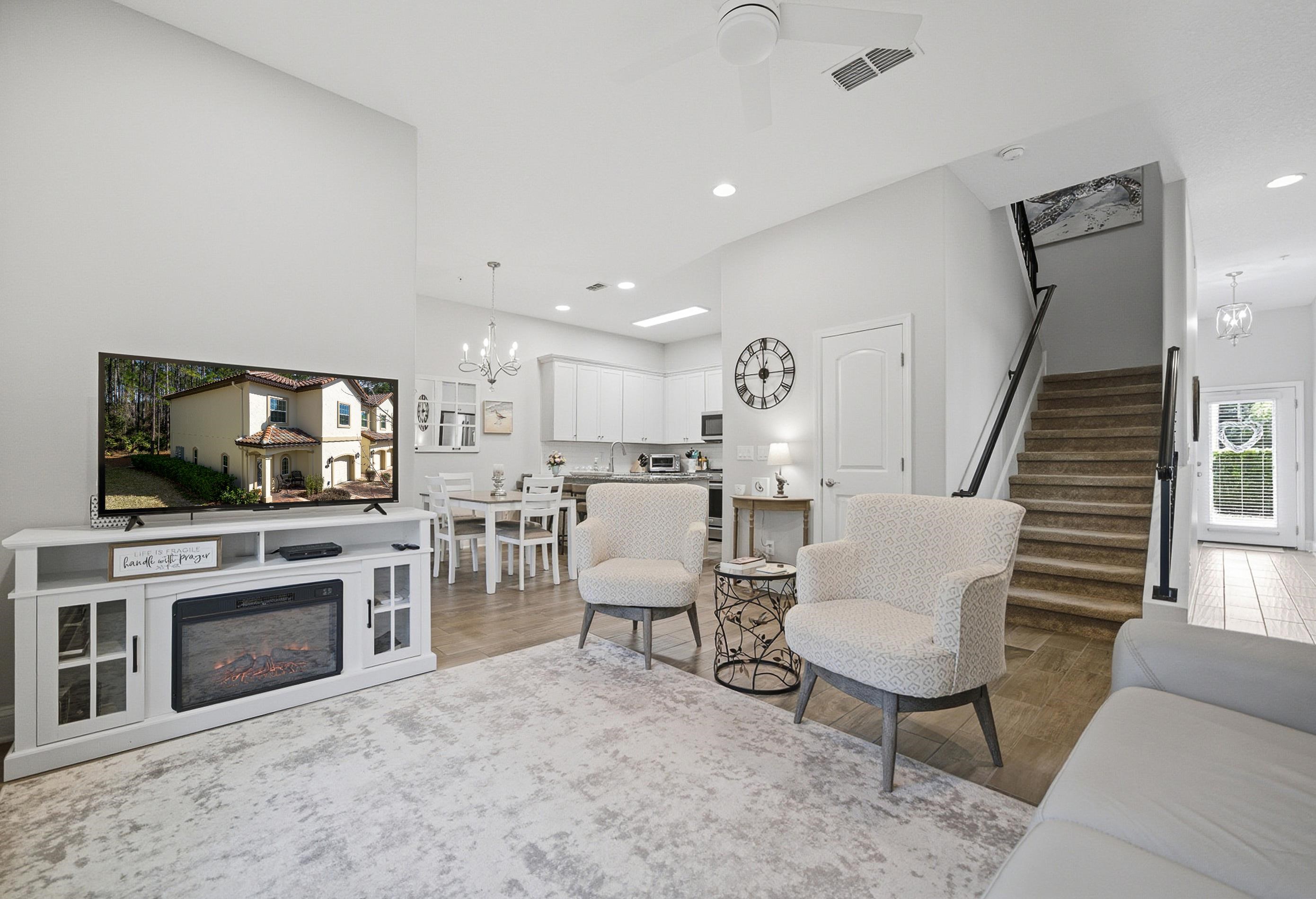 200 Grand Ravine Drive St. Augustine, FL 32086 - Photo 5 of 34 Living area with a chandelier, light wood-style floors, and ceiling fan