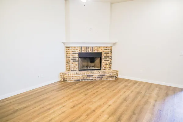 a view of front door with wooden floor