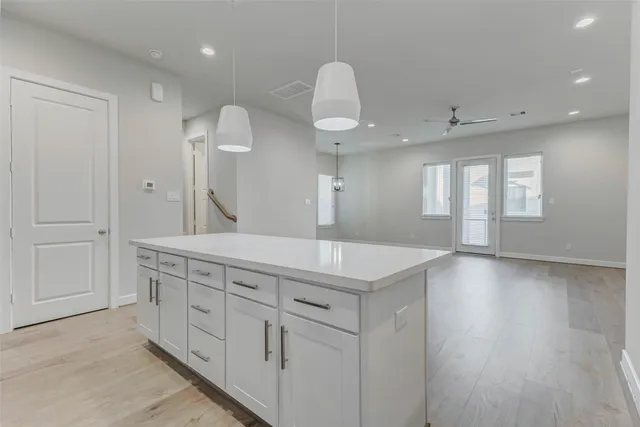 a bathroom with a sink a vanity and a large mirror