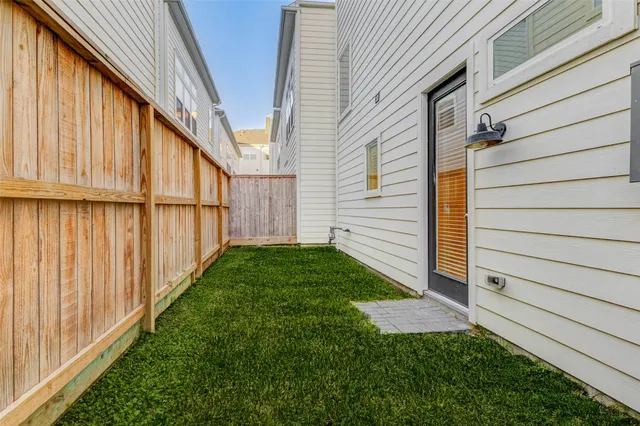 a view of a back yard of the house