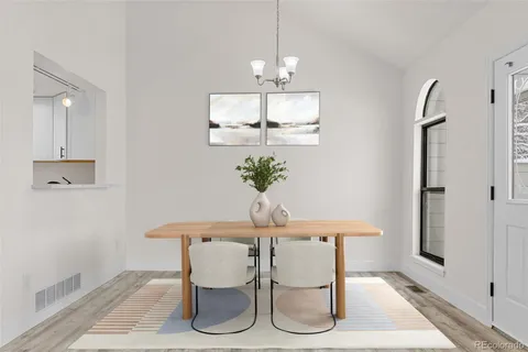 a dining room with furniture and window