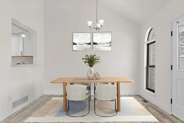 a dining room with furniture and window