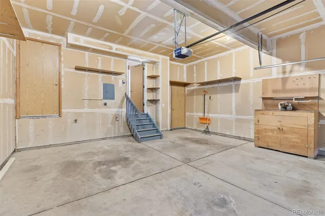 a front view of a house with a garden and yard