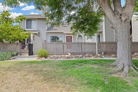 a view of a brick house with many windows