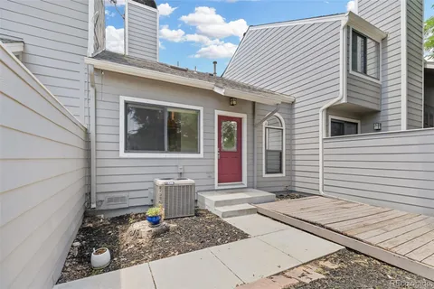 a front view of a house with a garage and a window