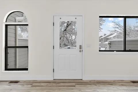 a view of wooden floor with a window