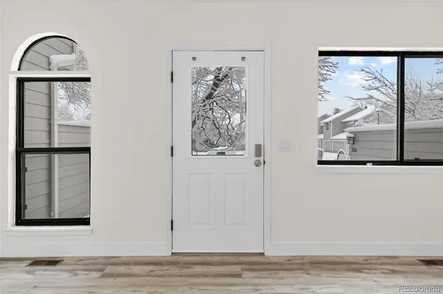 a view of wooden floor with a window