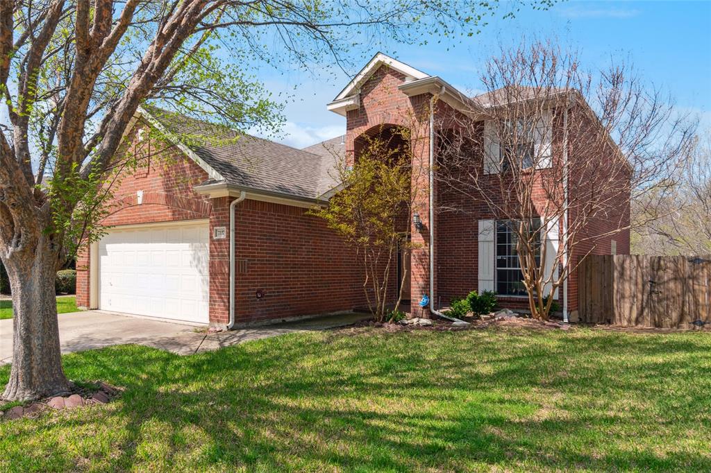 7117 Boysenberry Lane Plano, TX 75074 - Photo 1 of 1 a view of a house with a small yard and large tree