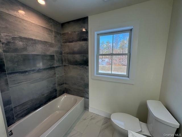 Lot #9 Colonels Path Manorville, NY 11949 - Photo 13 of 26 a bathroom with a toilet bathtub and window