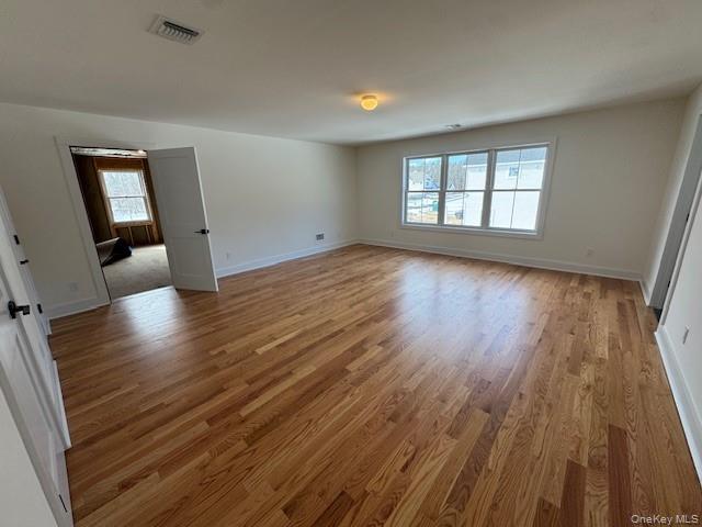 Lot #9 Colonels Path Manorville, NY 11949 - Photo 19 of 26 wooden floor in an empty room with a window
