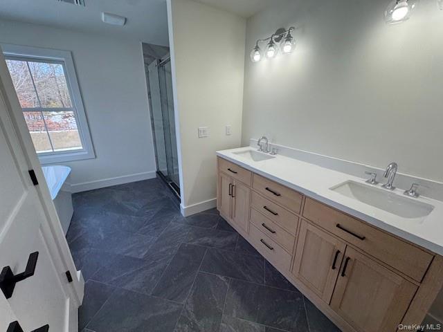 Lot #9 Colonels Path Manorville, NY 11949 - Photo 23 of 26 a spacious bathroom with double vanity sink a mirror and a shower