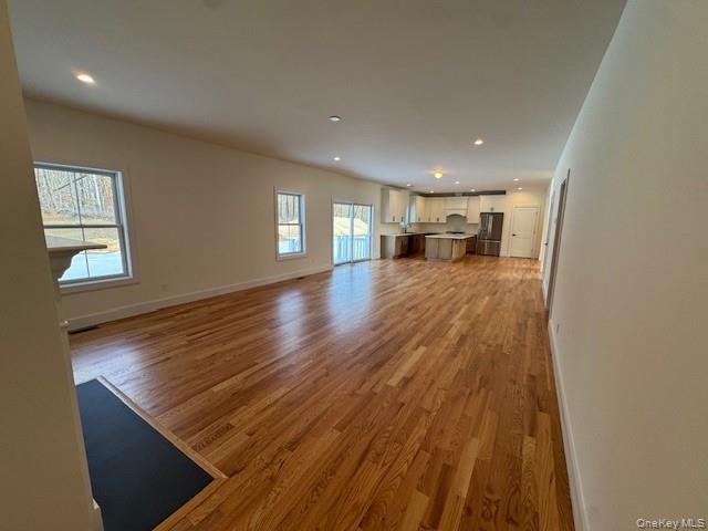 Lot #9 Colonels Path Manorville, NY 11949 - Photo 5 of 26 a view of a living room with wooden floor