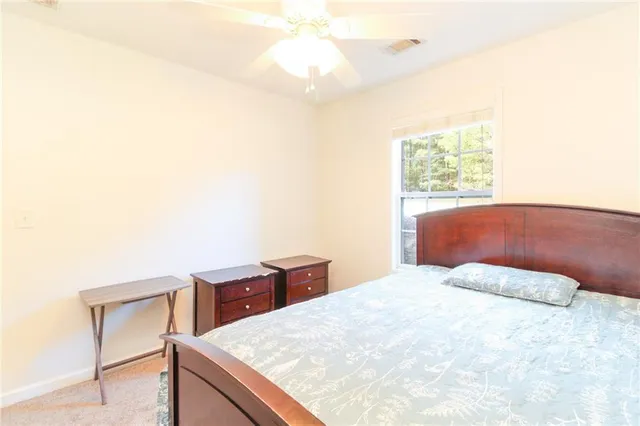 a bedroom with a bed and a cabinets