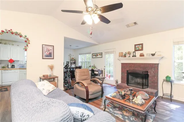 a living room with furniture and a fireplace