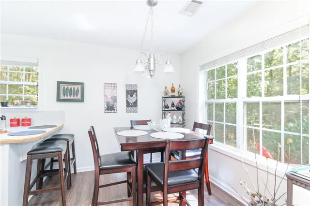 a view of a dining room with furniture window and outside view