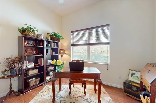 a workspace with furniture and a bookshelf