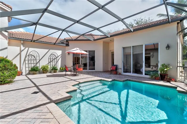 a view of a house with backyard and porch